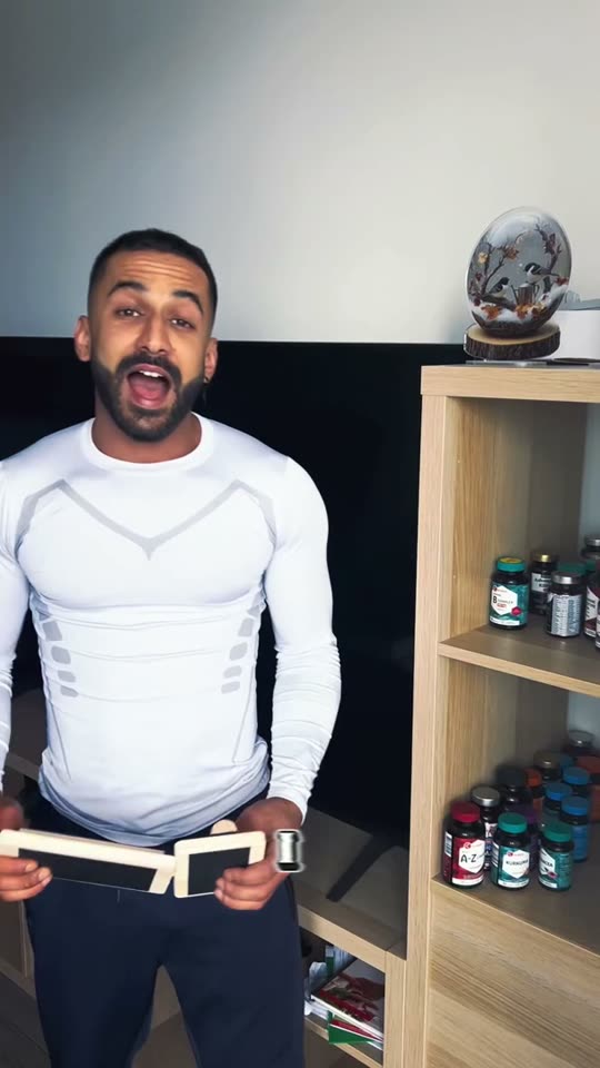 Moo in a white training top explaining an ankle board